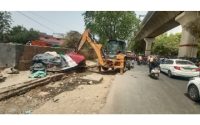 Bulldozer rolls near Delhi's Rithala metro station
