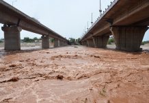 Water overflows the banks of the Tawi River in Jammu on Wednesday, June 22, 2022